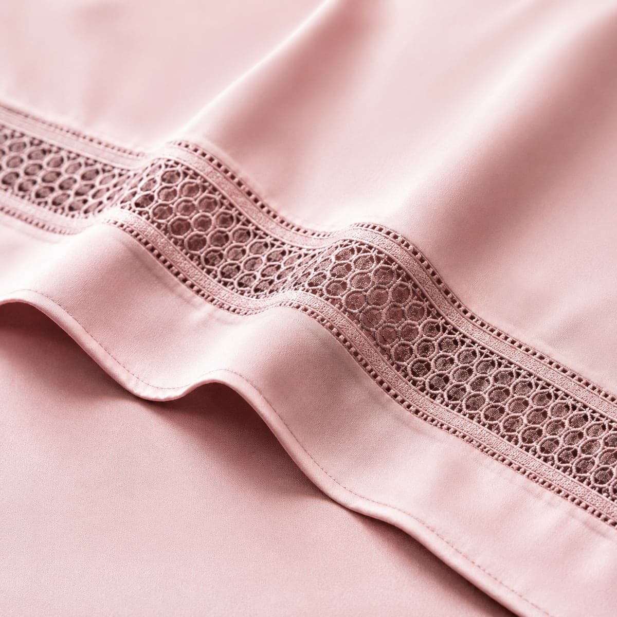 Close-up of the embroidered border on the Blush Pink set