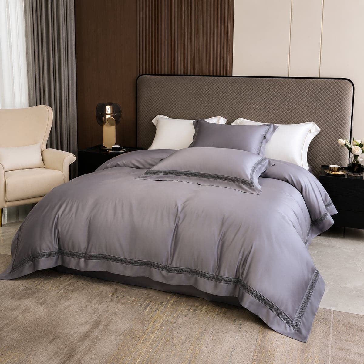 A king bed dressed in the Dove Grey bedding set, in soft window light