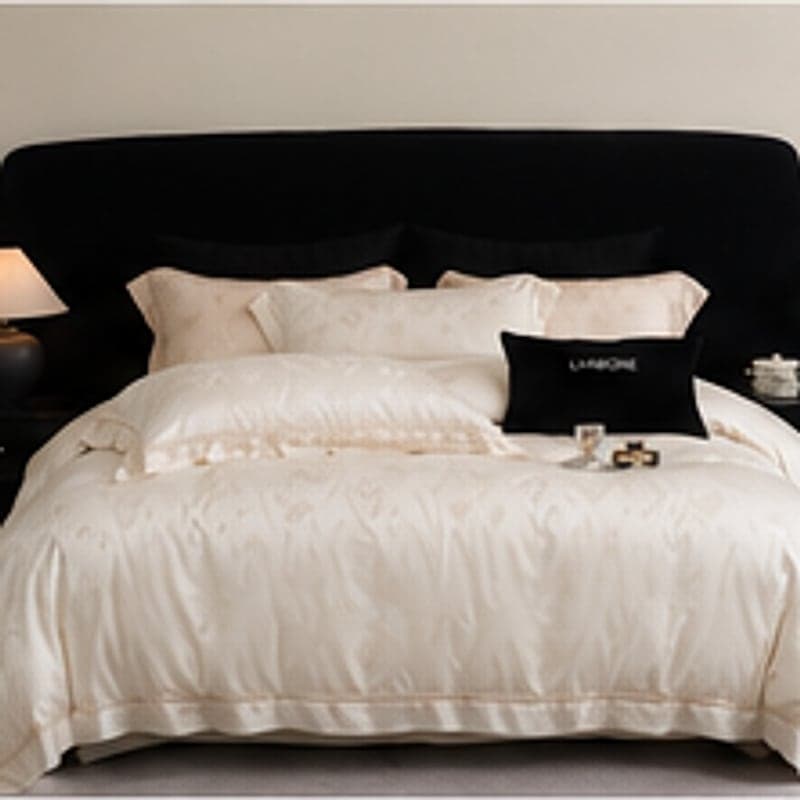 The Ivory White jacquard bedding set on a king bed
